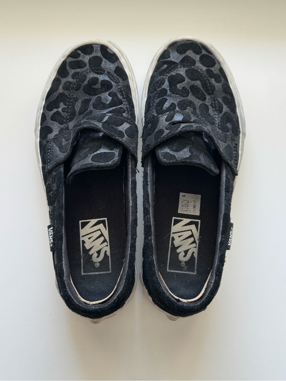 Vans Slip-On Sneakers in Black Leopard Pattern